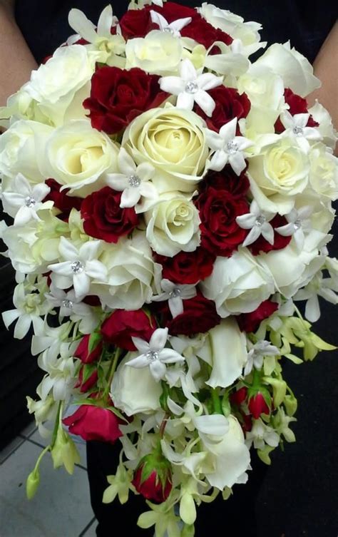 Cascading Bridal Bouquet Of White Roses Red Roses Stephanotis And