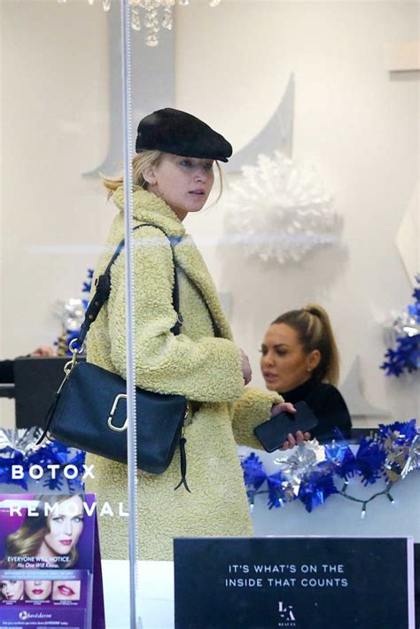 Jennifer Lawrence In A Yellow Fur Coat Does Some Christmas Shopping In