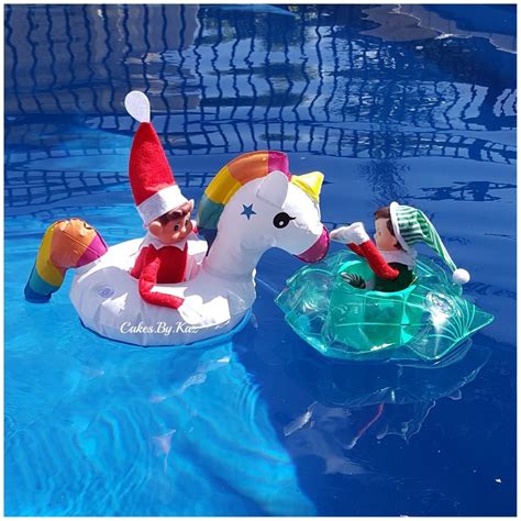 elf on the shelf having fun in the pool in their new floats