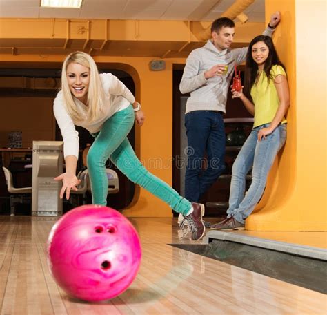 Group Of Smiling People Playing Bowling Stock Image Image Of Brunette