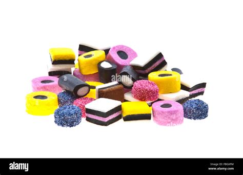 Selection Of Liquorice Allsorts Sweets In Colourful Abstract Stack