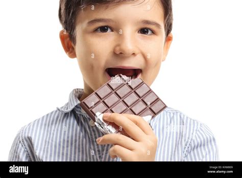 Little Boy Eating Chocolate Isolated On White Background Stock Photo