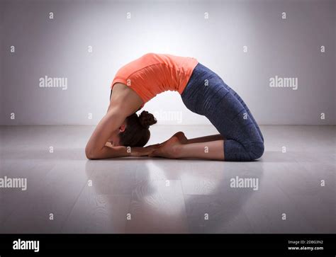 Beautiful Sporty Fit Yogini Woman Practices Yoga Asana Kapotasana