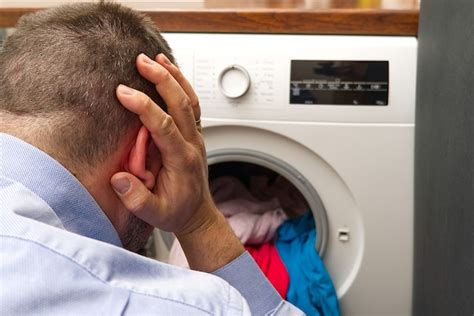 Premium Photo Man Being Worried About The Washing Machine Because It Doesnt Work