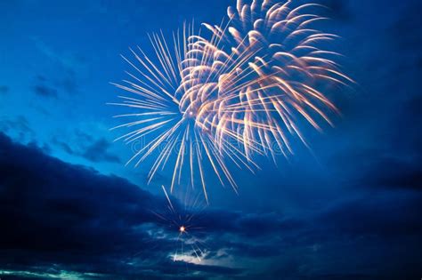 Colorful Fireworks On The Blue Cloudy Sky Stock Photo Image Of Party