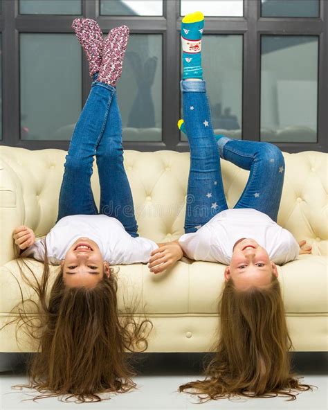 Little Cute Girls Couch Upside Down Stock Photos Free And Royalty Free