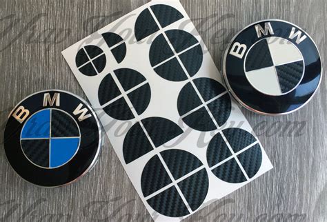 A real carbon fiber bmw wheel emblem. Half black carbon fiber BMW badge emblem overlay trunk rims