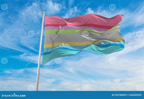 Flag Of Gender Questioning Waving In The Wind At Cloudy Sky Fre Stock