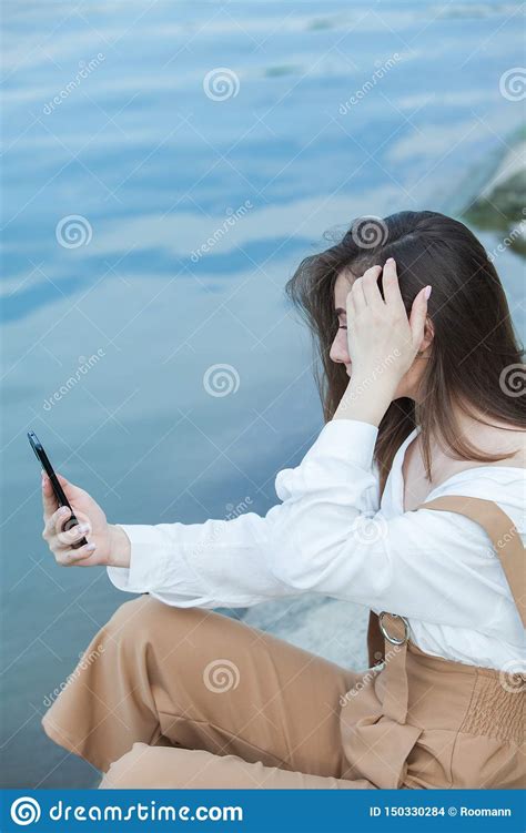 Girl Outdoors Texting On Her Mobile Phone Girl With Phone Portrait Of