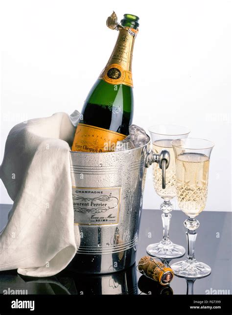 Veuve Clicquot Champagne In Ice Bucket With Napkin And Crystal Glasses