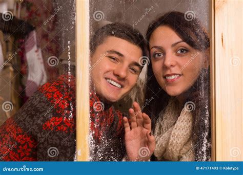 Young Sweethearts Smiling Behind Glass Window Stock Image Image Of