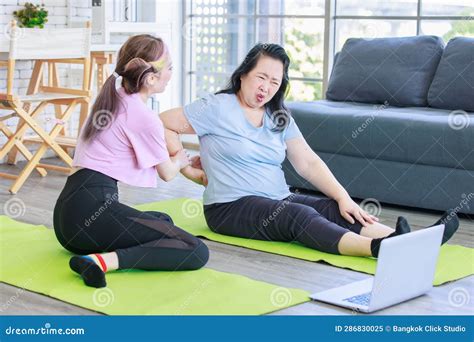 Asian Old Senior Chubby Pensioner Retirement Mother Sitting On Yoga Mat