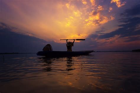 Premium Photo Silhouette Fisherman With Sunset