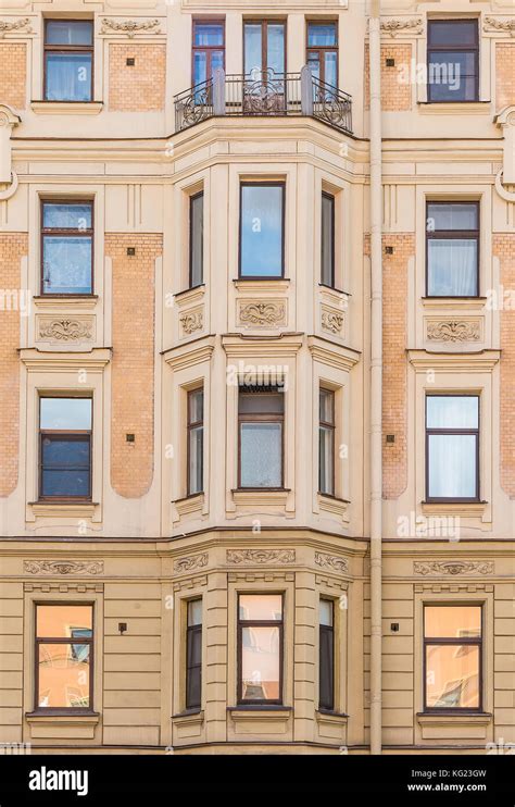 Several Windows In A Row And Bay Window On Facade Of Urban Apartment