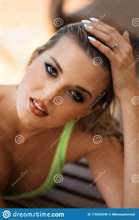 Vertical Close Up Portrait Of Young Beautiful Tanned Slim Blonde Woman