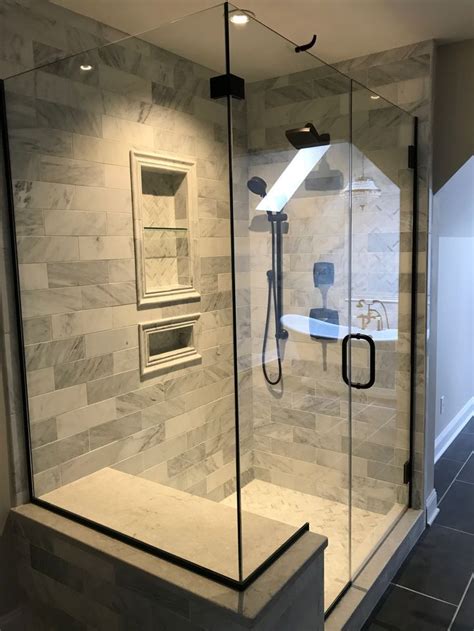 hampton carrera marble tile oil rubbed bronze shower fixtures shower remodel luxury bathroom