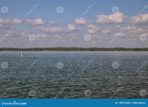 View Of The Lake With Blue Skies And Clouds Stock Image Image Of
