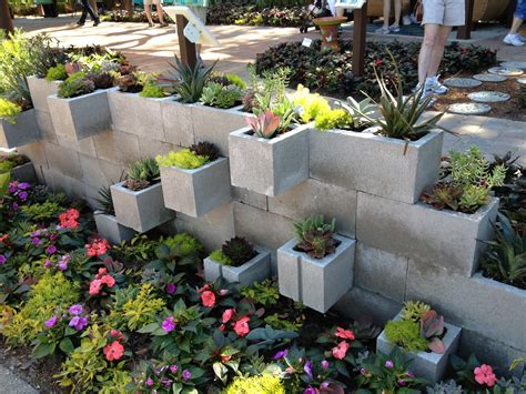 Cut out the landscape fabric so that it covers the hole and goes up to about 1/4. Seeking a Greener Thumb: Cinder Block Succulent Planter