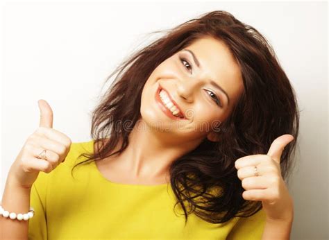 Lovely Woman Showing Victory Or Peace Sign Over White Background Stock
