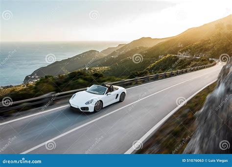 White Car In Mountain Road With Speed Blur Editorial Stock Photo