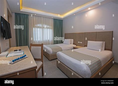 Twin Beds In Suite Of A Luxury Hotel Room With Modern Interior Design Decor Furniture Stock