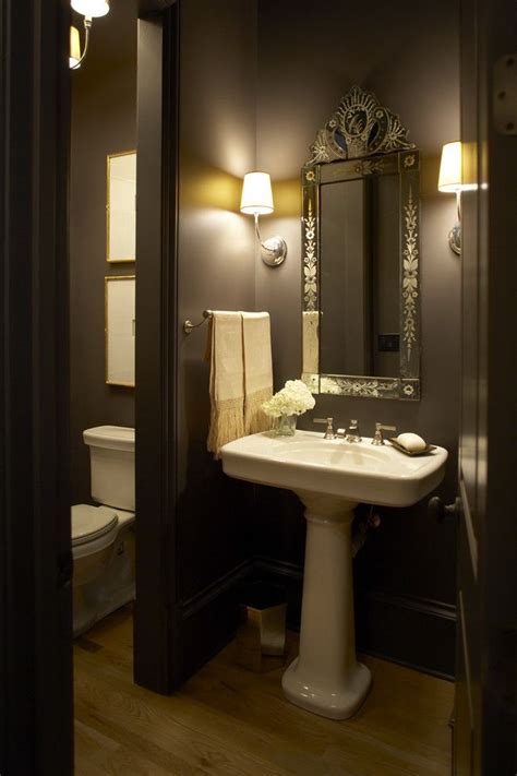 While powder rooms serve an important purpose—particularly for guests—small square footage and awkward layouts can present some design challenges. Separate room for toilet and dark, tall walls - perfect ...