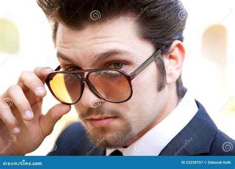 Handsome Guy Looking Over Sunglasses Stock Image Image Of Male Glasses 23238707