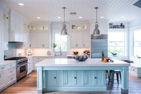 Coastal Style White Kitchen With Blue Island Crystal Cabinets