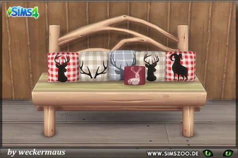 A Wooden Bench With Plaid And Deer Pillows On It