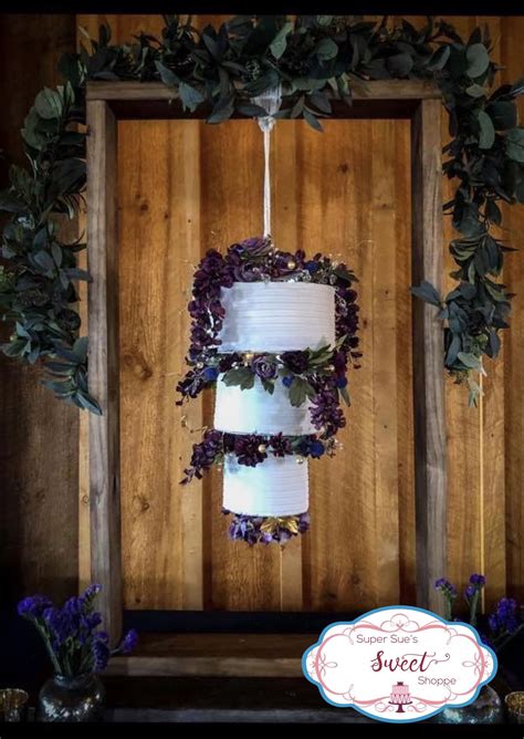 Power! and also credited the wedding photographers, project2pi. This wedding cake is all real cake suspended upside down ...