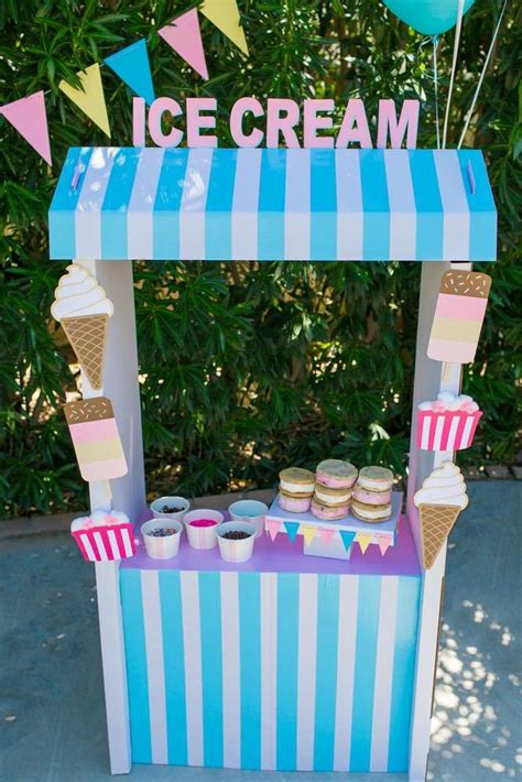 An Ice Cream Stand With Cupcakes On It