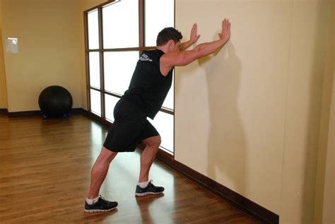 Calf Stretch Hands Against Wall Exercise Guide And Video