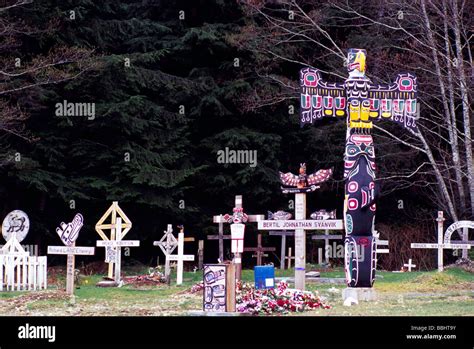 kwakwaka wakw kwakiutl totem poles in first nations cemetery alert bay bc british columbia