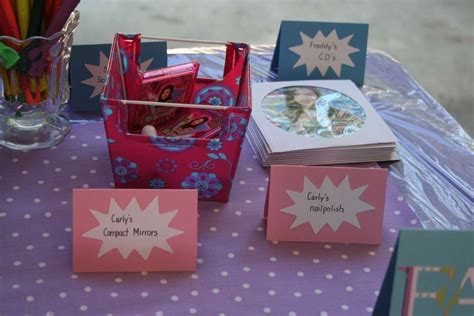A Table Topped With Lots Of Cards And Boxes