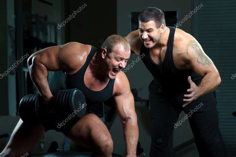 Two Bodybuilders Training In Gym — Stock Photo © Dontcut 4267354