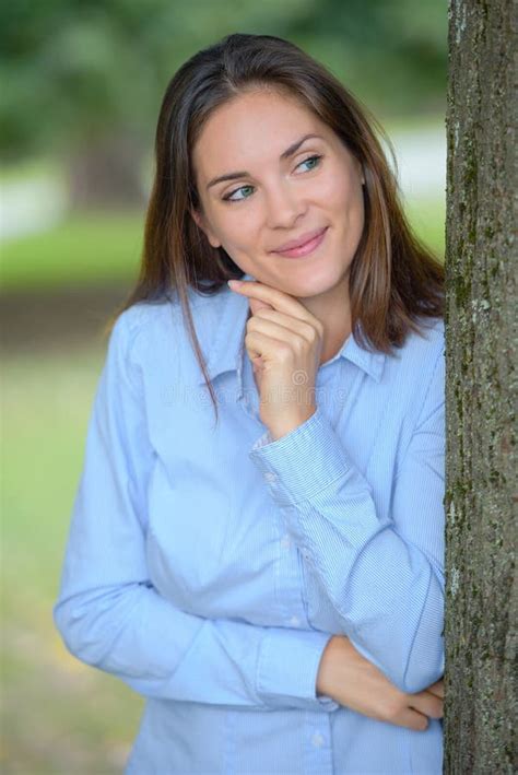 portrait woman behind tree stock image image of smile 268034485