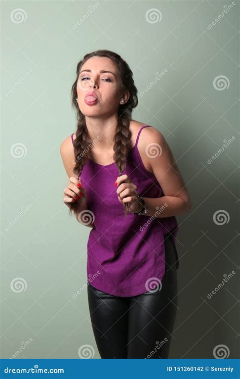 Portrait Of Naughty Young Woman On Color Background Stock Photo Image