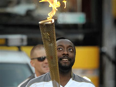 surprise the olympic torch bearer is will i am cbs news