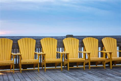 Yellow Beach Chairs In A Row Stock Photo Image Of Daybreak Boardwalk