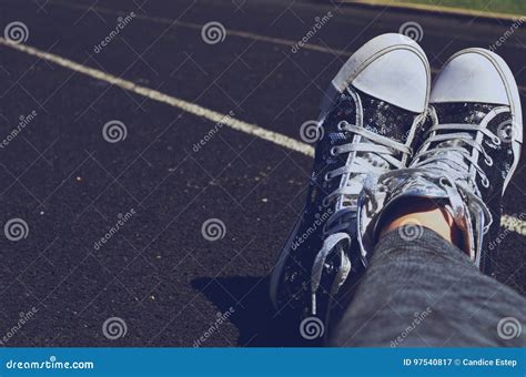 Feet Crossed In Shoes On Track Stock Image Image Of Black Shoes