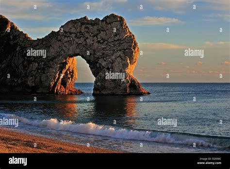 Durdle Door A Natural Limestone Arch At Sunset Along The Jurassic