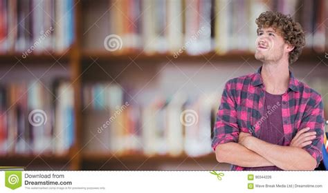 Student With His Hands Folded On Blurred Background Stock Photo Image