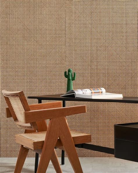 A Wooden Chair Sitting In Front Of A Table With A Book On Top Of It