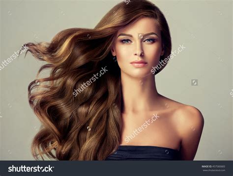 Brunette Girl With Long And Shiny Wavy Hair Beautiful Model With Curly Hairstyle Burgundy