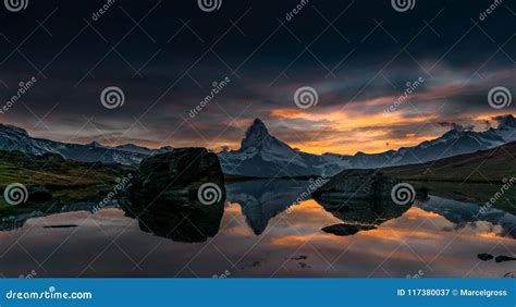 Sunset On Dem Matterhorn And Its Reflection In A Mountain Lake Stock