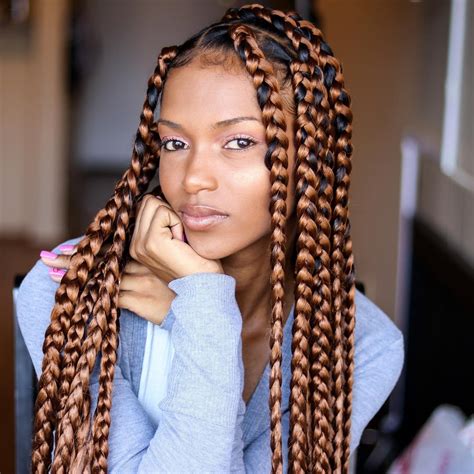 Knotless braids can be styled in so many different and trendy ways. Jumbo Summer Box Braids