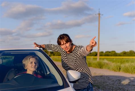 Woman Giving Directions To A Lost Driver Stock Photo Image Of