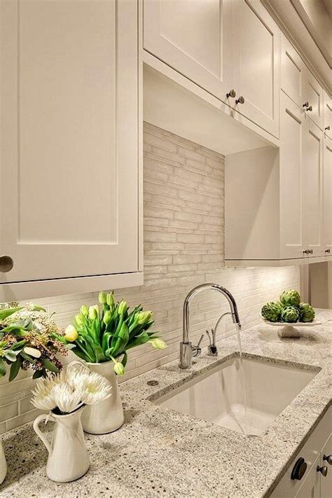 You can follow a similar design path as quartz when using this material for your countertops. White quartz or granite countertops. White Cabinets. Light ...