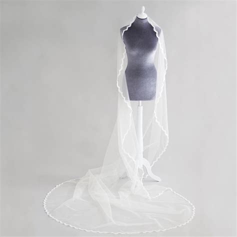 Adeline Is A Barley There Wedding Veil With Delicate Lace Edge All