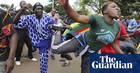Protesters In Zimbabwe Call For Mugabe To Step Down In Pictures World News The Guardian